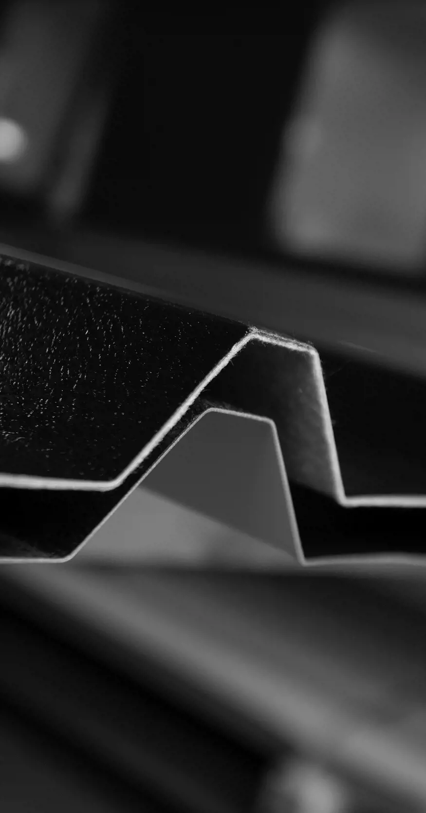 Abstract greyscale image of corrugated steel